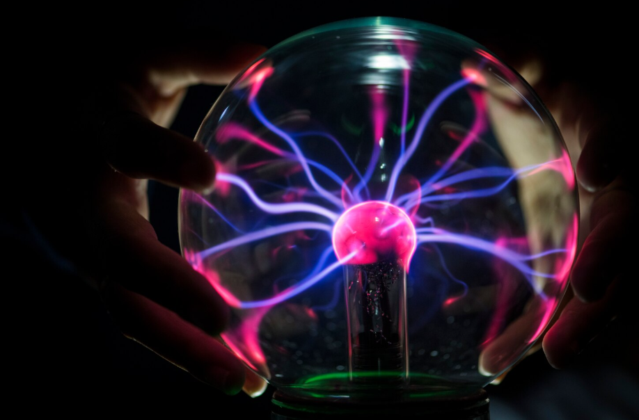 Close-up of a plasma globe with glowing filaments, symbolizing quantum entanglement.